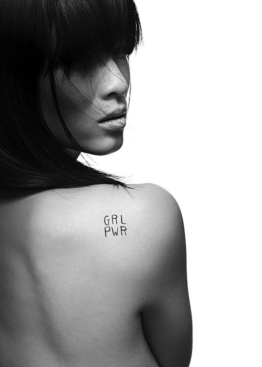  - Artful black and white photo poster of a woman with a “GRL PWR” tattoo on her shoulder blade.