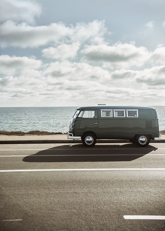  - Vintage poster with the motif of an old dark-green VW camper van on a road by the sea.