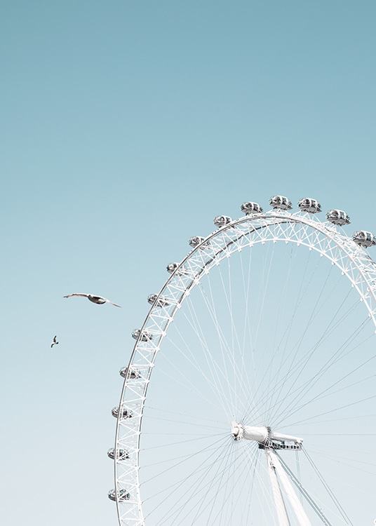 - Artful shot of the London Eye with a clear blue sky in the background.