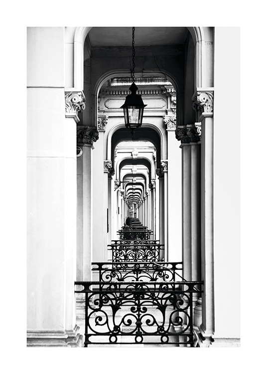 - Black and white photo of old building arches in London, as far as the eye can see.