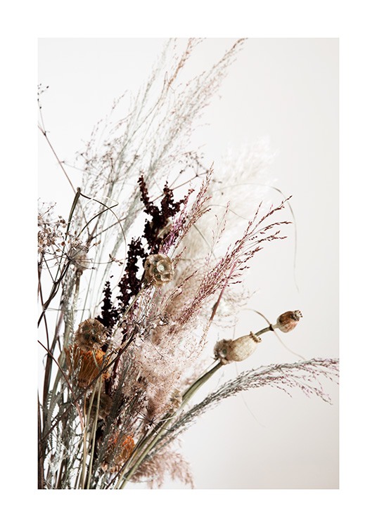  – Photograph of dried flowers and grass in a bouquet against a light grey background