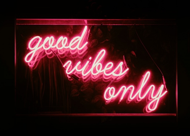  – Poster with a pink neon sign on a dark background. 