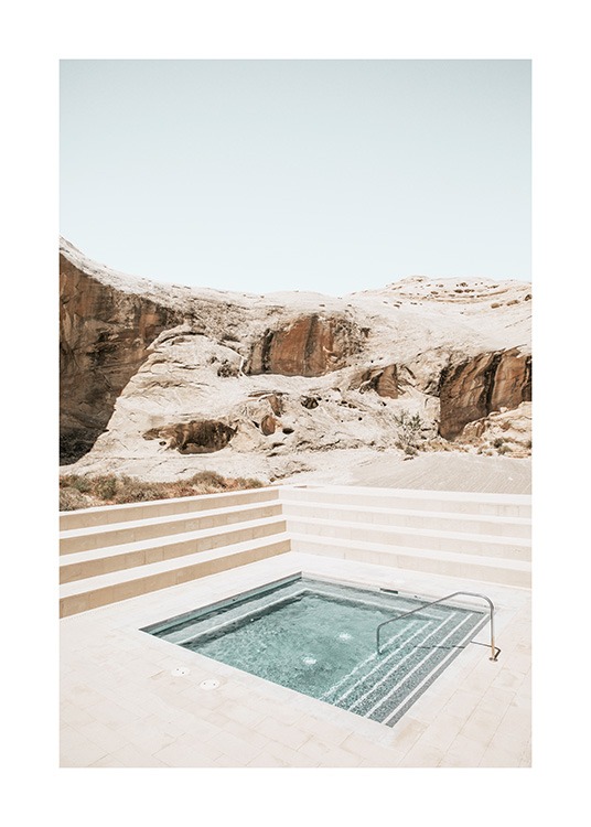  – Photograph of canyons behind a square pool surrounded by stairs