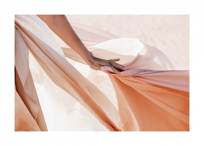  – Photograph of sheer fabric in peach being held by woman's hand
