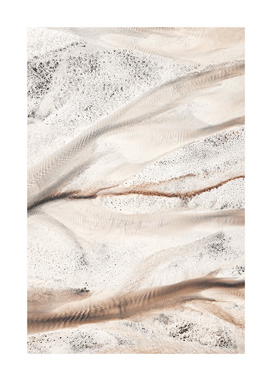  - Close up of beige river bed with black spots and ridges