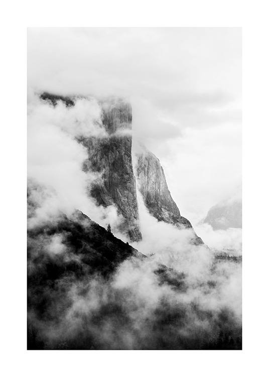  - Black and white photograph of El Capitan covered in fog, a rock formation in California
