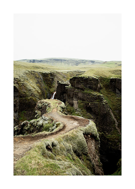 - Photograph of narrow path in green landscape on Iceland