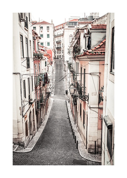  - Photograph from Lisbon of a street surrounded by pastel houses in white and peach