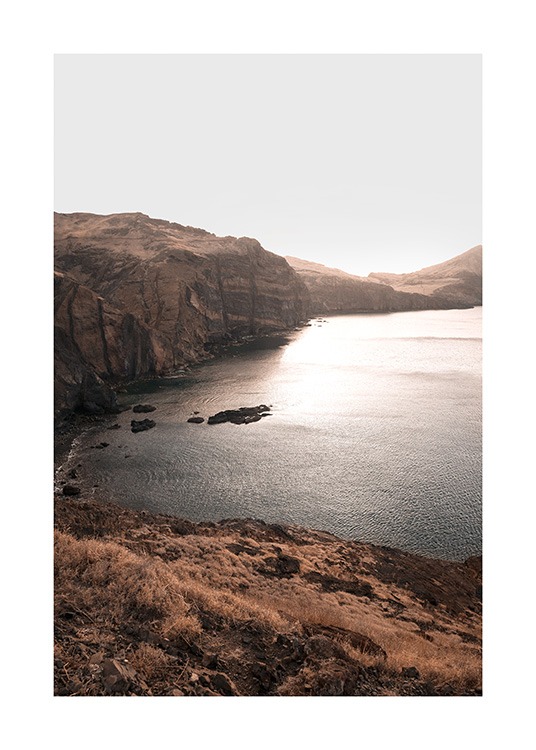  – Photograph of a mountain landscape and a lake in the sunset