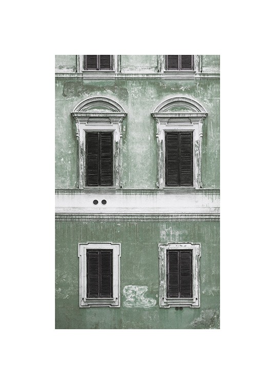  – Photograph of a green facade with a vintage feel and black and white windows