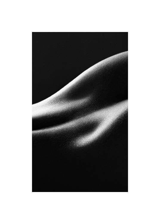  - Black and white close up photograph of a woman's lower back