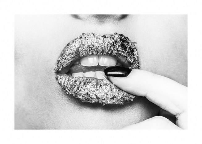  - Black and white photograph of a pair of lips covered in foil with a finger inbetween them