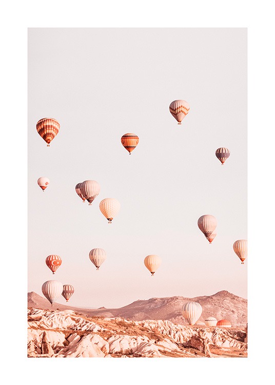  – Photograph of a mountain landscape with air balloons flying over the mountains