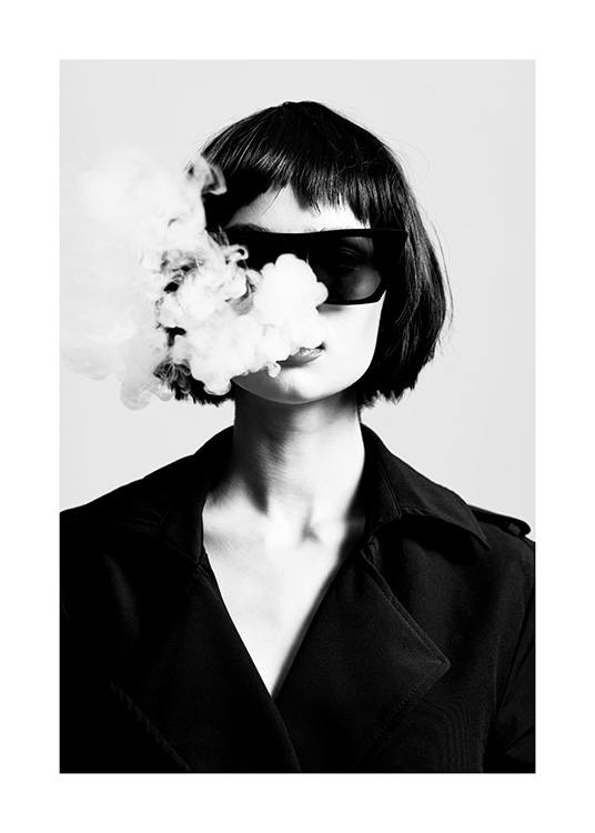  – Black and white photograph of a woman wearing sunglasses and a jacket with smoke coming out of her mouth