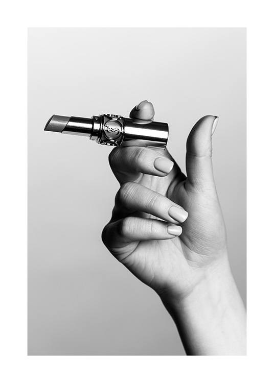  – Black and white photograph of a YSL lipstick held between fingers like a cigarette