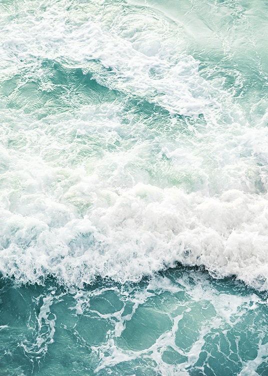  – Photograph of an ocean with clear blue water and sea foam