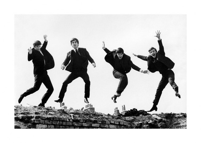  – Black and white photograph of the members of the Beatles jumping in the air