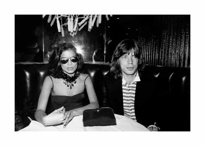  – Black and white photograph of Mick and Bianca Jagger, seated in a booth at Studio 54