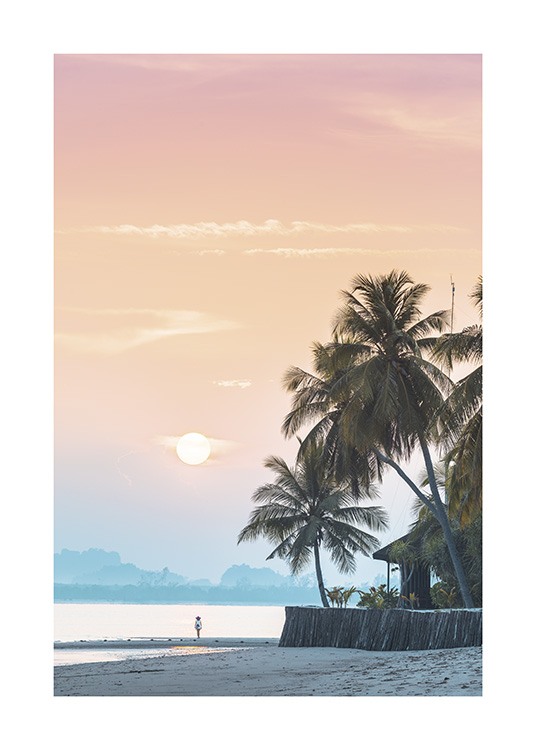  – Photograph of a pink and orange sky behind palm trees on a beach