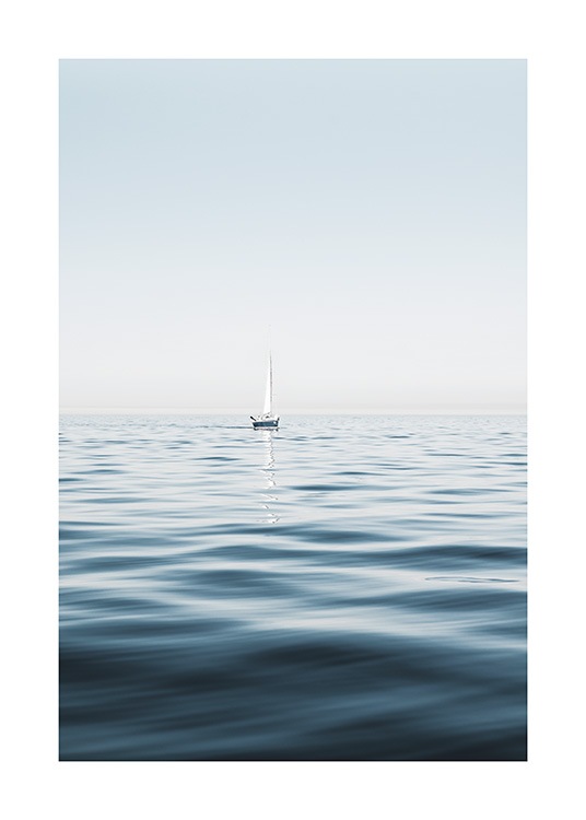  – Photograph of a sailboat in a clear blue ocean with calm waves