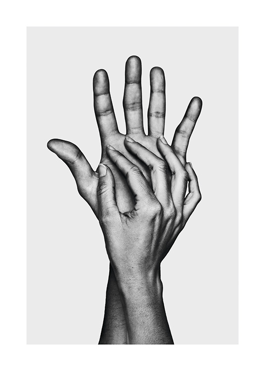  – Black and white photograph of two hands touching each other, on a light grey background