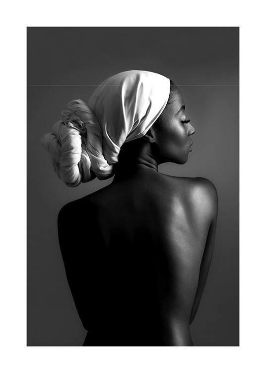  – Black and white photograph of a woman with her hair wrapped in a scarf, seen from behind