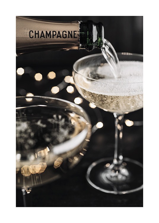  – Photograph of a bottle with champagne being poured into a champagne glass