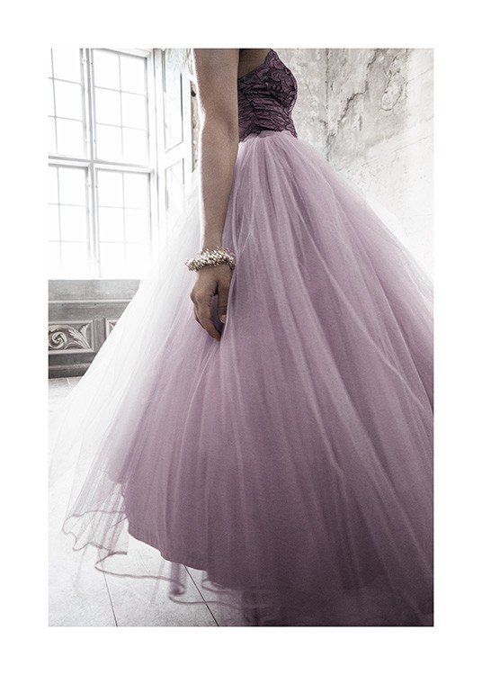  – Photograph of a woman wearing a dress with a lilac tulle skirt, and a gold bracelet