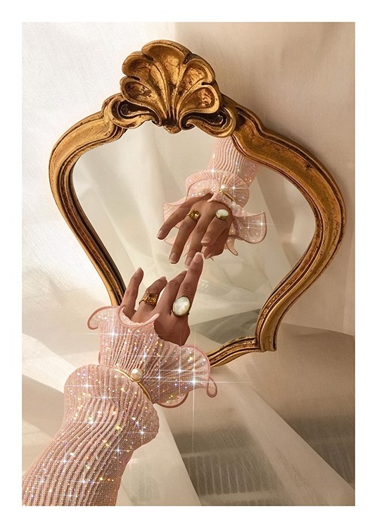  – Photograph of an arm covered by a pink, glittering sleeve, stretched towards a gold mirror