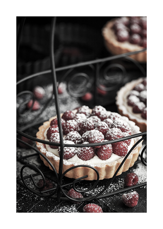  – Photograph of raspberry pastries with icing sugar on a metal tray with carvings