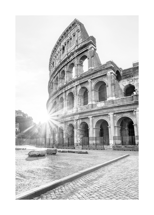  – Black and white photograph of the Colosseum in Rome with sunlight in the background