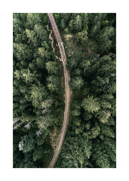 – Aerial photograph of a train track in the middle of a green forest