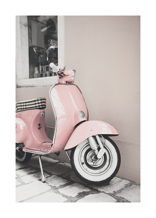 – Photograph of a vintage scooter in pink, standing outside of a beige building