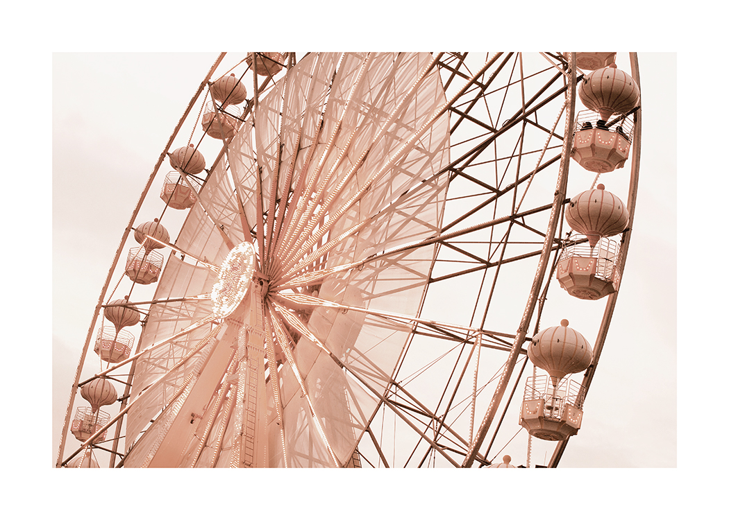  – Photograph of a ferris wheel in pink with a light beige sky in the background