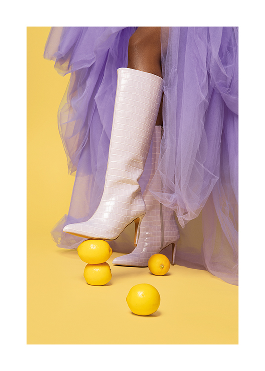  – Faux snakeskin heeled boots squishing two lemons on a yellow surface
