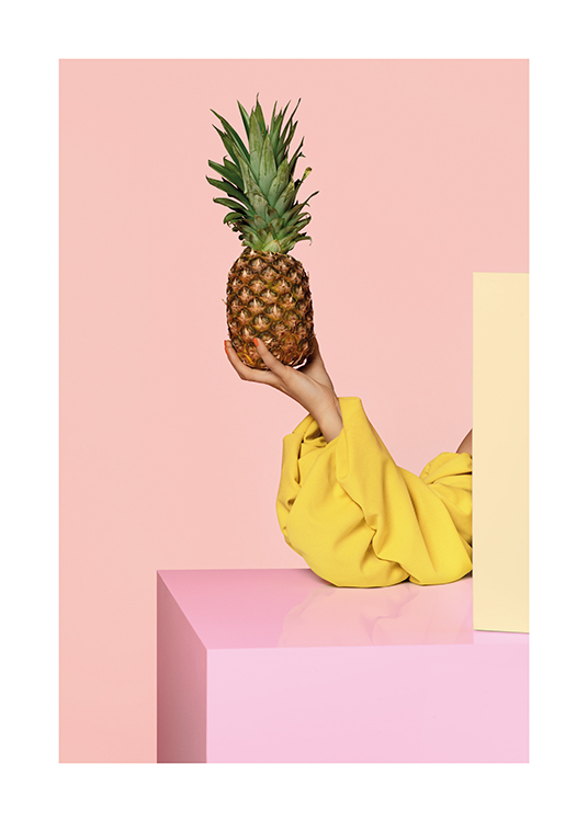  – A woman concealed by boxes holding a pineapple on a pale pink background