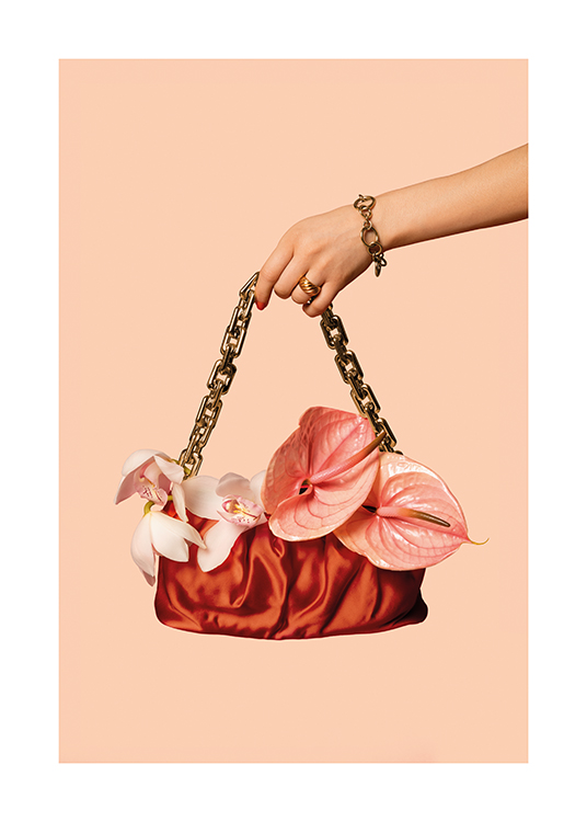  – A woman holding a handbag adorned with flowers