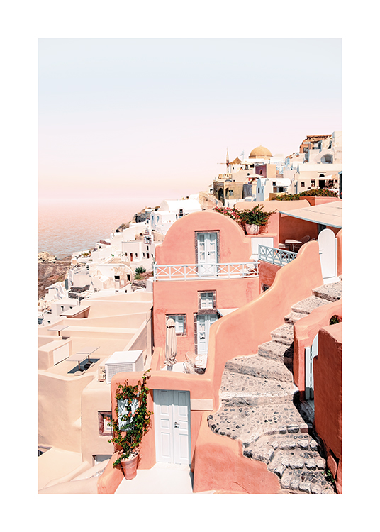  – Photograph of beige and pink houses in the city of Santorini, with the sea and sky in the background