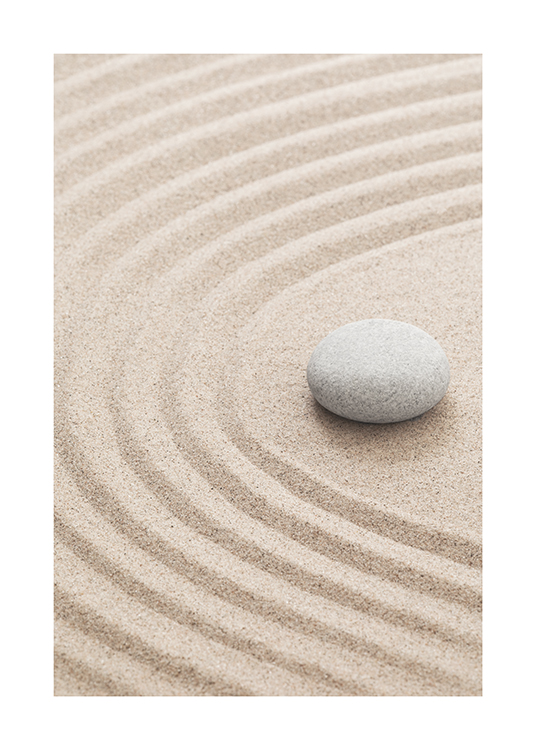  – Photograph of ridged sand with a grey rock laying on it