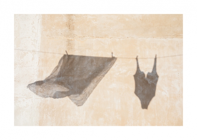 – A silhouette of a towel and swimwear on a clothes line