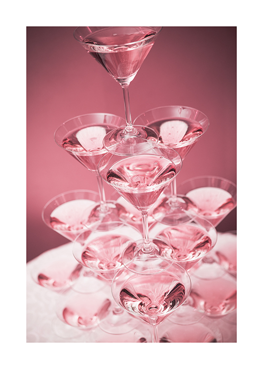  – Photograph of a pyramid of cocktail glasses with pink drinks against a pink background