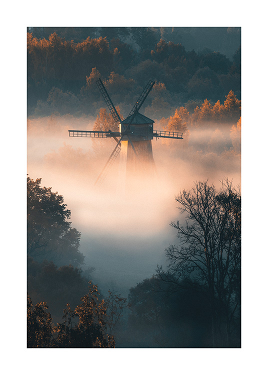  – Photograph of a foggy forest with a windmill in the fog, with sunlight shining on the forest