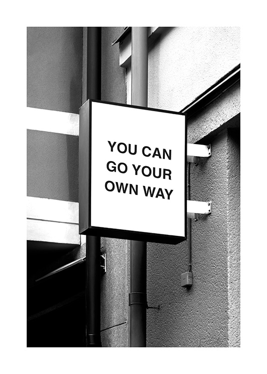 – A black and white quote print on with an inspiring text on the house wall