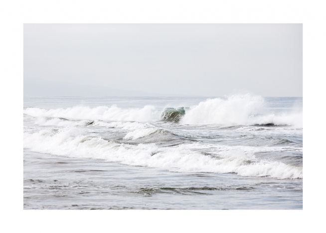  - Photograph in pastel hues with ocean waves closing up to the shore