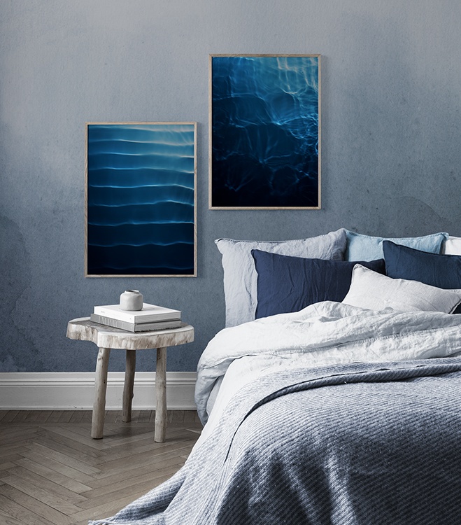 Blue bedroom with dark blue poster pair