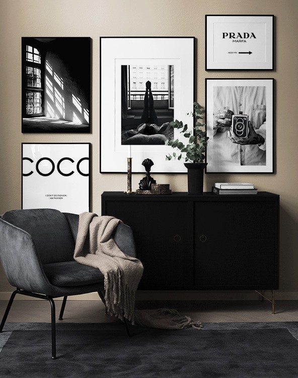 Living room with black-and-white photos and text posters